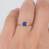 East-West Dainty Blue Sapphire Trio Diamond Engagement Ring