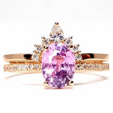 Oval Pink Sapphire Engagement Ring with a Matching Halo Diamond Wedding Band