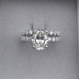 Oval Moissanite Solitaire Engagement Ring with a matching Natural Diamond Wedding Band
