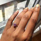 Oval Pink Sapphire Engagement Ring with a Matching Halo Diamond Wedding Band