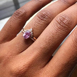 Oval Pink Sapphire Engagement Ring with a Matching Halo Diamond Wedding Band