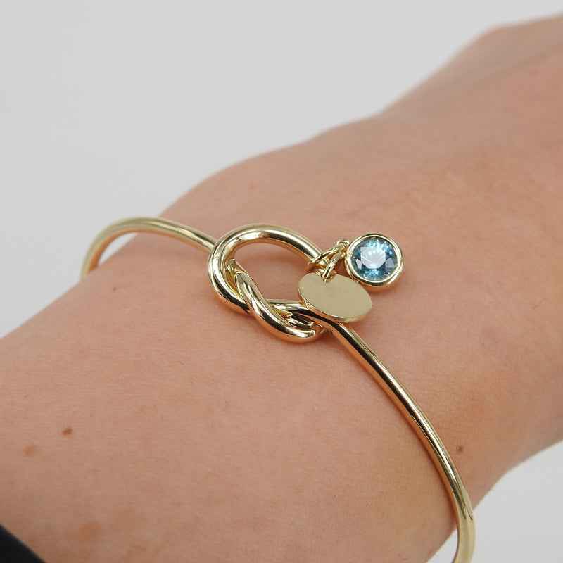 Solid Gold Knot Bangle – Personalized Aquamarine Birthstone & Engraved Medallion Charm