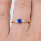 East-West Dainty Blue Sapphire Trio Diamond Engagement Ring