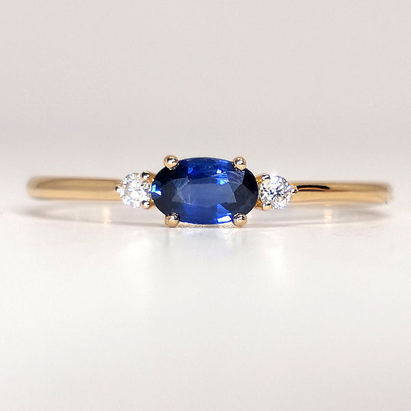 East-West Dainty Oval Blue Sapphire Engagement Ring